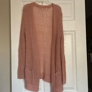 Shimmering knitted pink with golden pink, threading size medium, no label